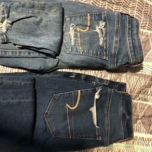 Dark and light wash jeans, distressed.